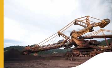 Image of a large equipment operating in an earthy area