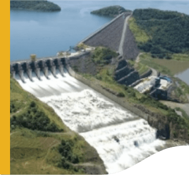 Photo of the Machadinho Hydropower Plant with a concrete structure and moving water passing through the structures.